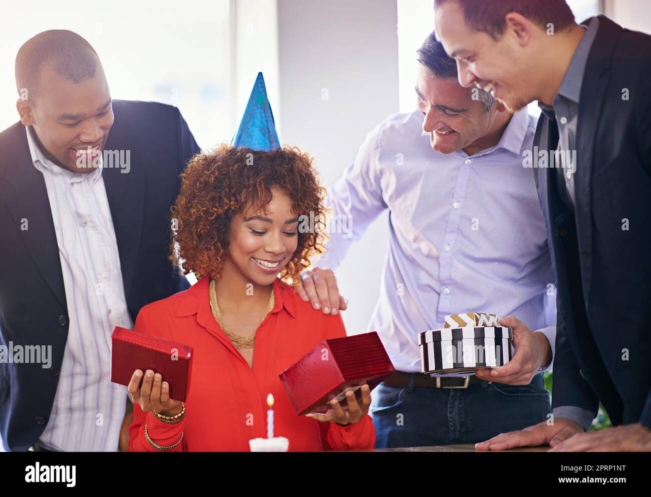 You shouldnt have...a group of coworkers celebrating a birthday. Stock Photo