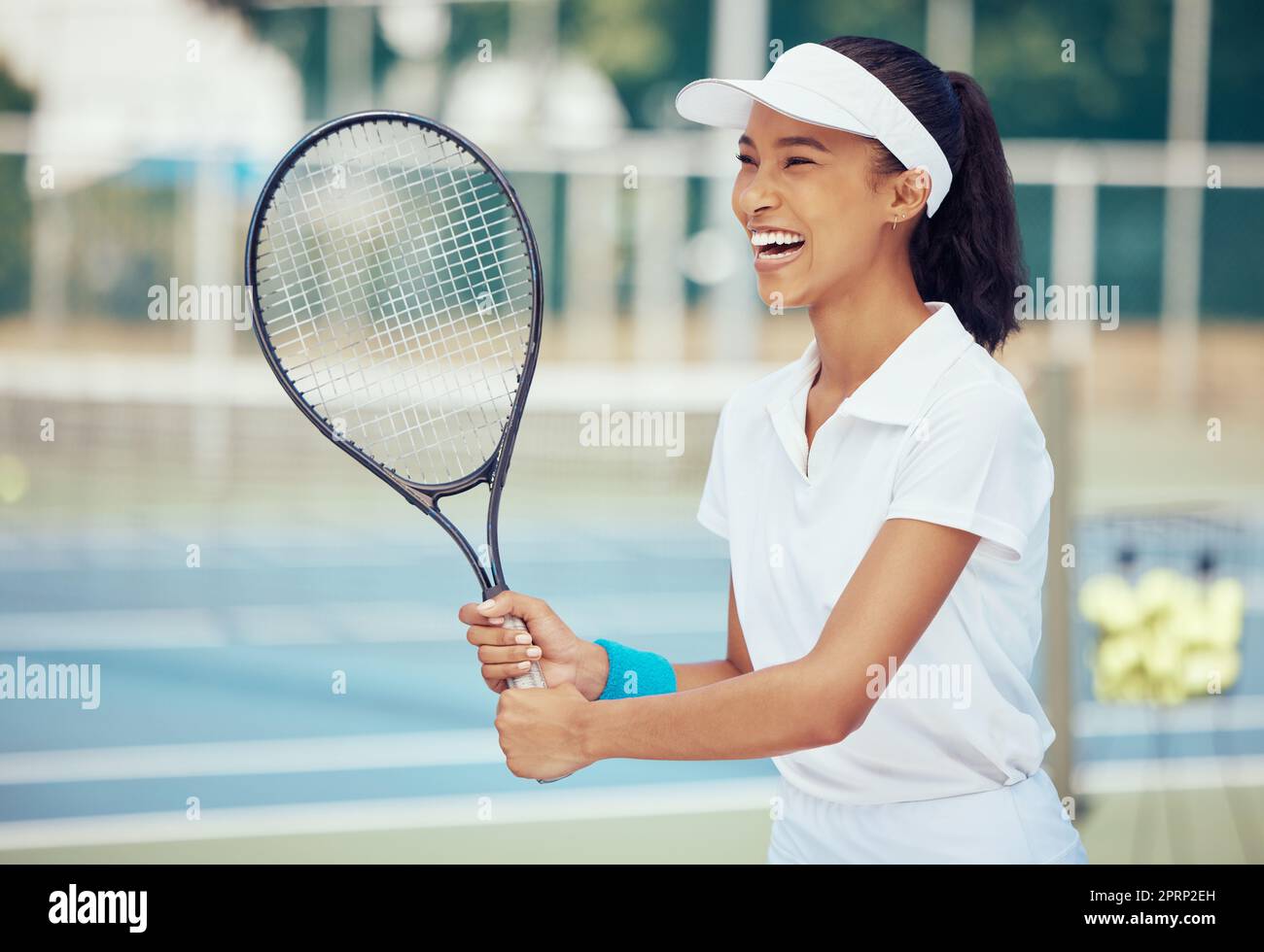 Athlete, training and woman tennis player with a racket practicing to play a game on a court. Happy, active and fitness girl in sports with a wellness, exercise and healthy lifestyle. Stock Photo