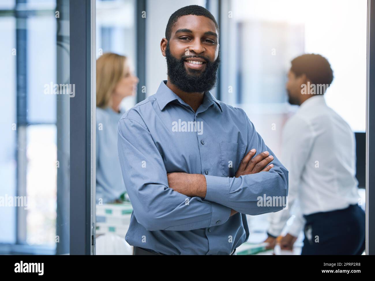 Confident and leadership portrait of a businessman in office meeting with vision for success, business recruitment and company growth. Smile of black man, manager or boss in a professional workplace Stock Photo