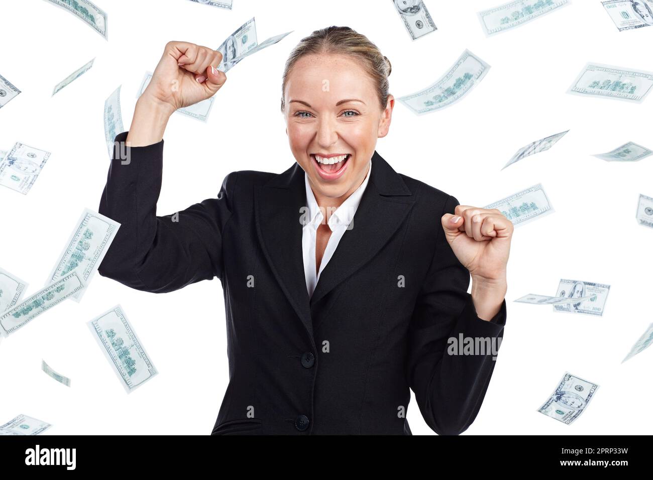 Its all about the money. Cropped portrait of a businesswoman cheering as money rains down against a white background. Stock Photo