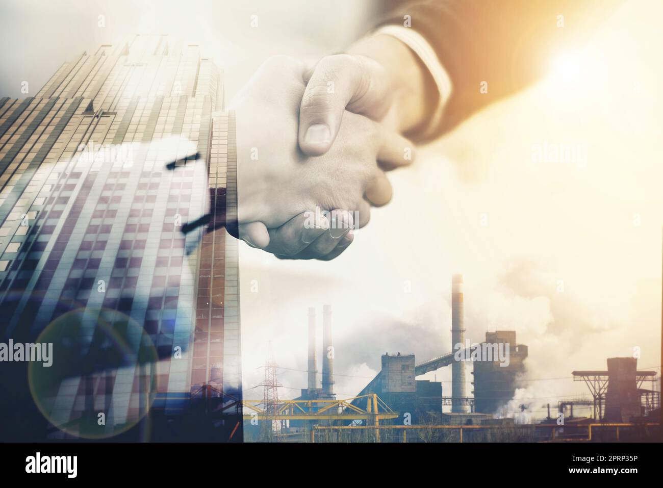 Business in the city. Multiple exposure shot of two businesspeople shaking hands over a city. Stock Photo