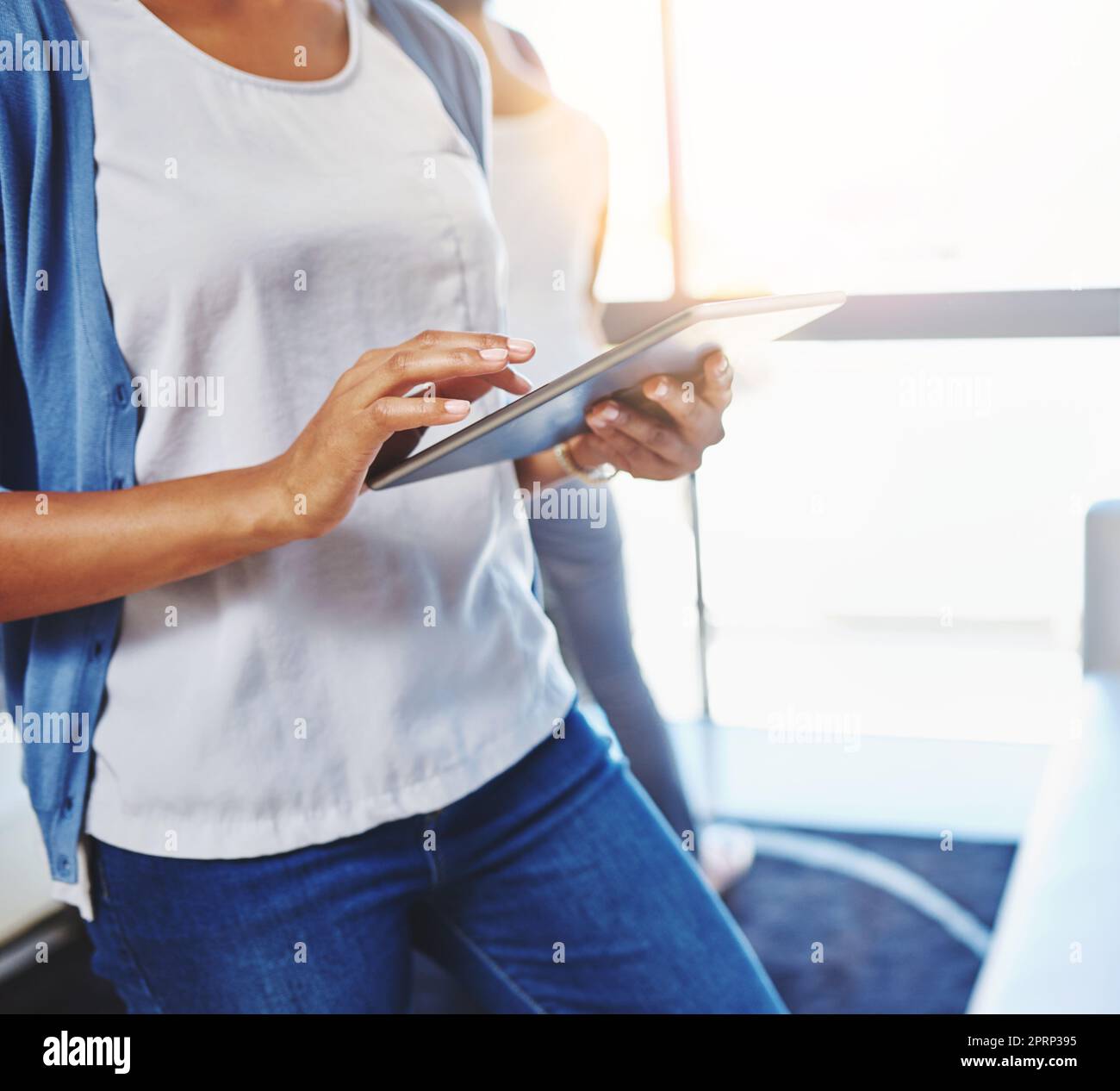 The perfect business tool for the modern professional. a businesswoman using a digital tablet at the office. Stock Photo