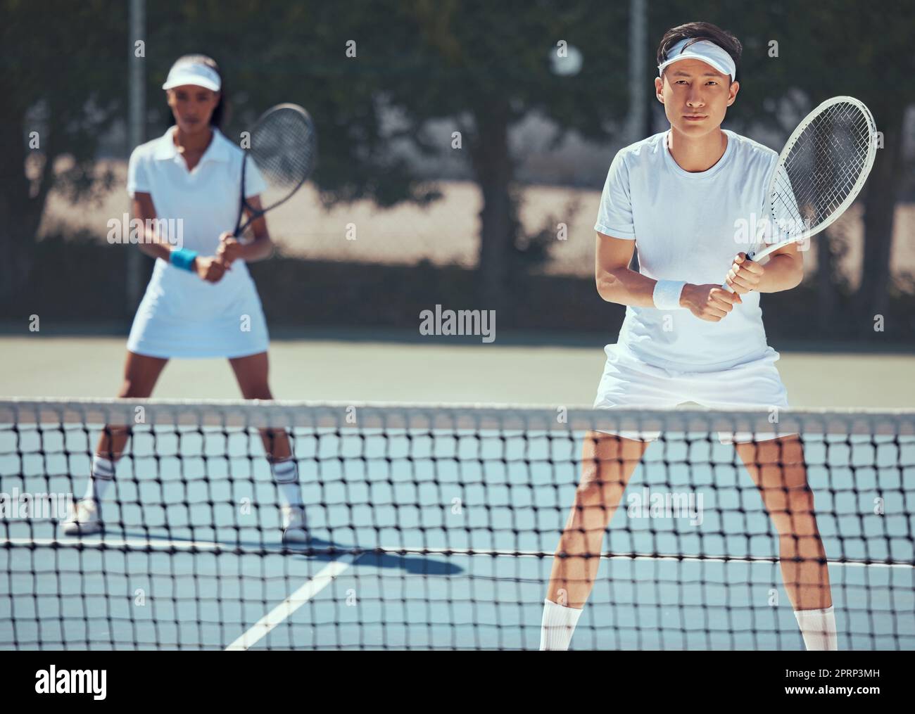 Team of tennis player in competition on court, teamwork in action sports game and training in collaboration for sport together in summer. Portrait of athlete man and woman doing fitness exercise Stock Photo