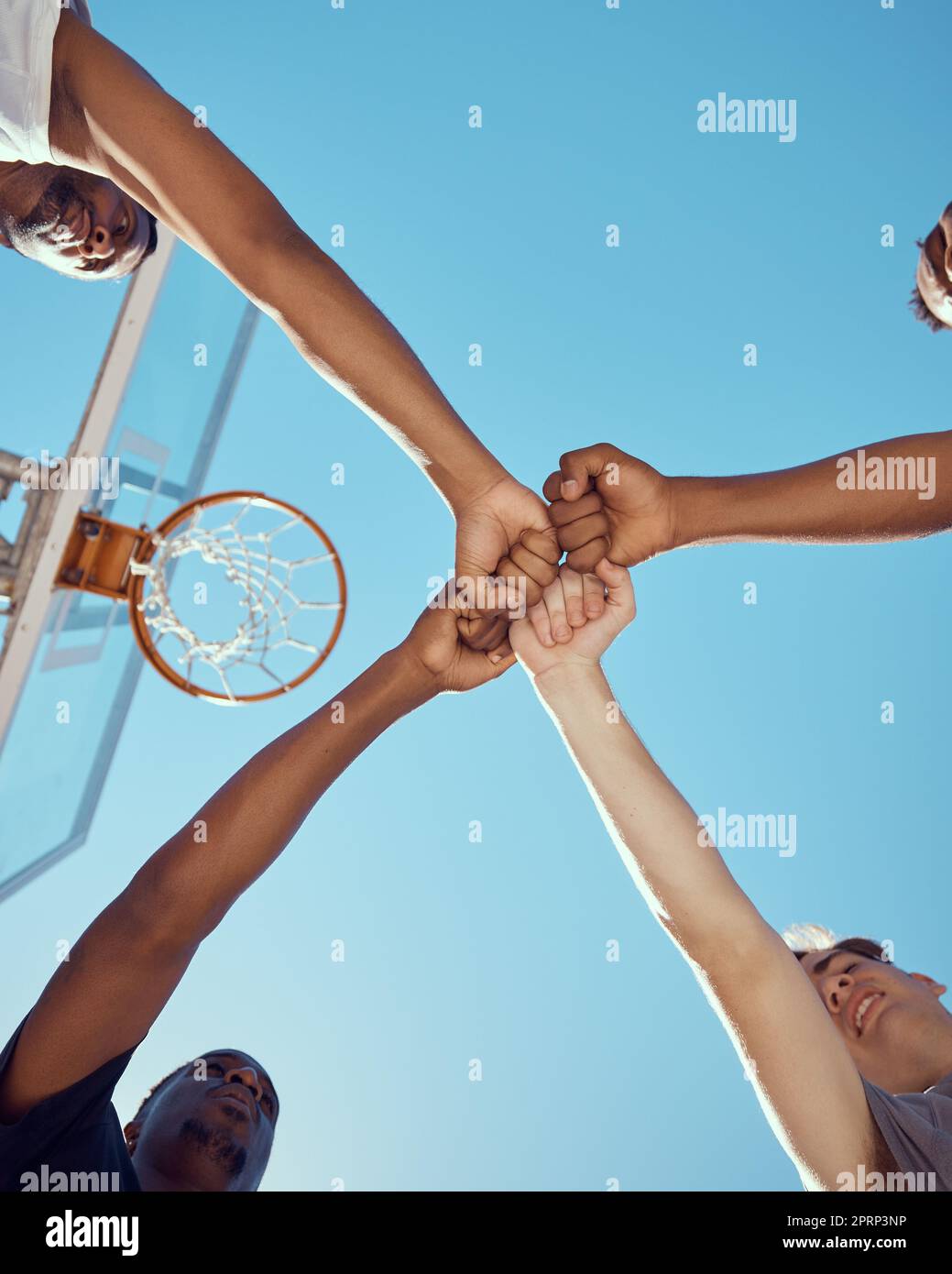 Diversity and hands of basketball sports teamwork in solidarity and collaboration to win game at basketball court. Motivation, fitness and healthy athlete men or tournament training group of people Stock Photo