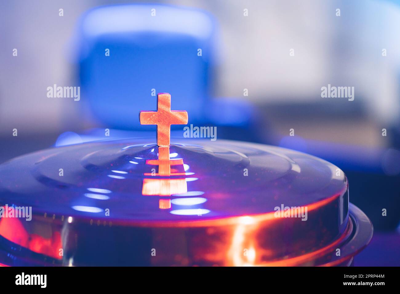 The process of breaking bread in the modern church Stock Photo Alamy
