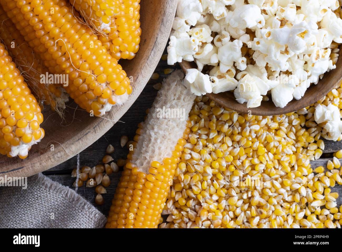 Harvesting popcorn from the cob flat lay with a bowl of popped corn