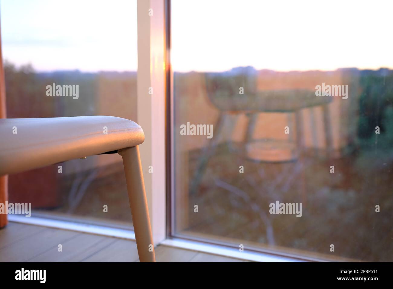 modern bliege chair in empty office space with large window, vintage picture style process,copy space. Stock Photo