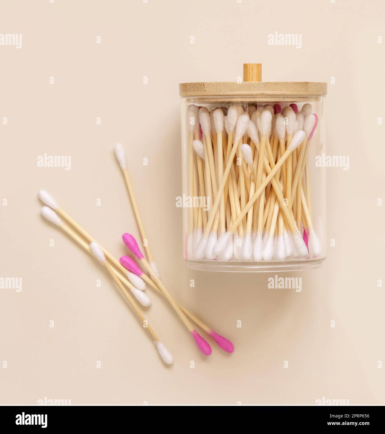 Bamboo cotton buds in a jar on light beige top view. Eco friendly skincare product Stock Photo
