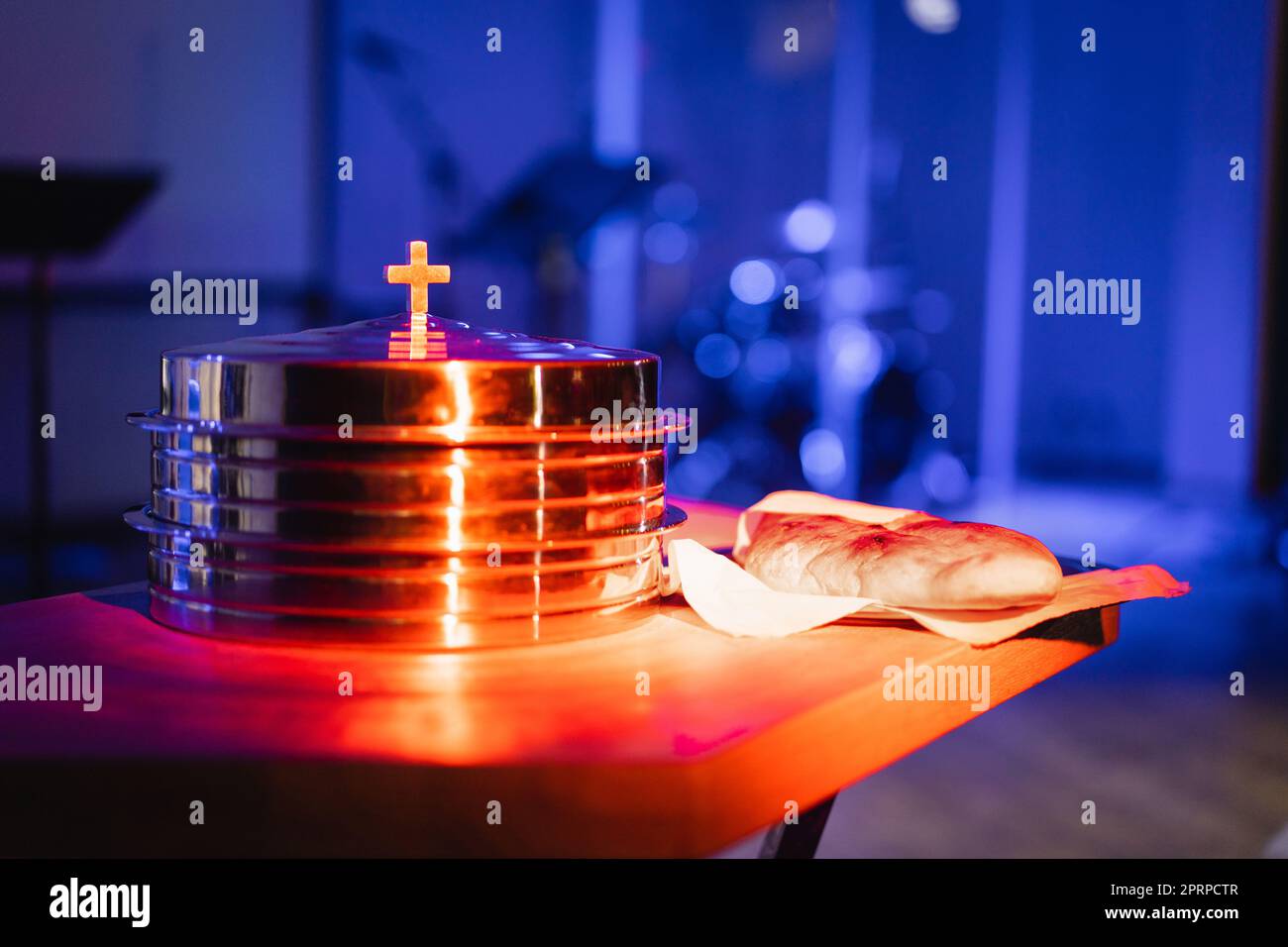 The process of breaking bread in the modern church Stock Photo Alamy