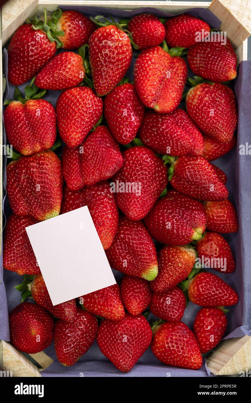 still life of strawberries with a label for text Stock Photo - Alamy