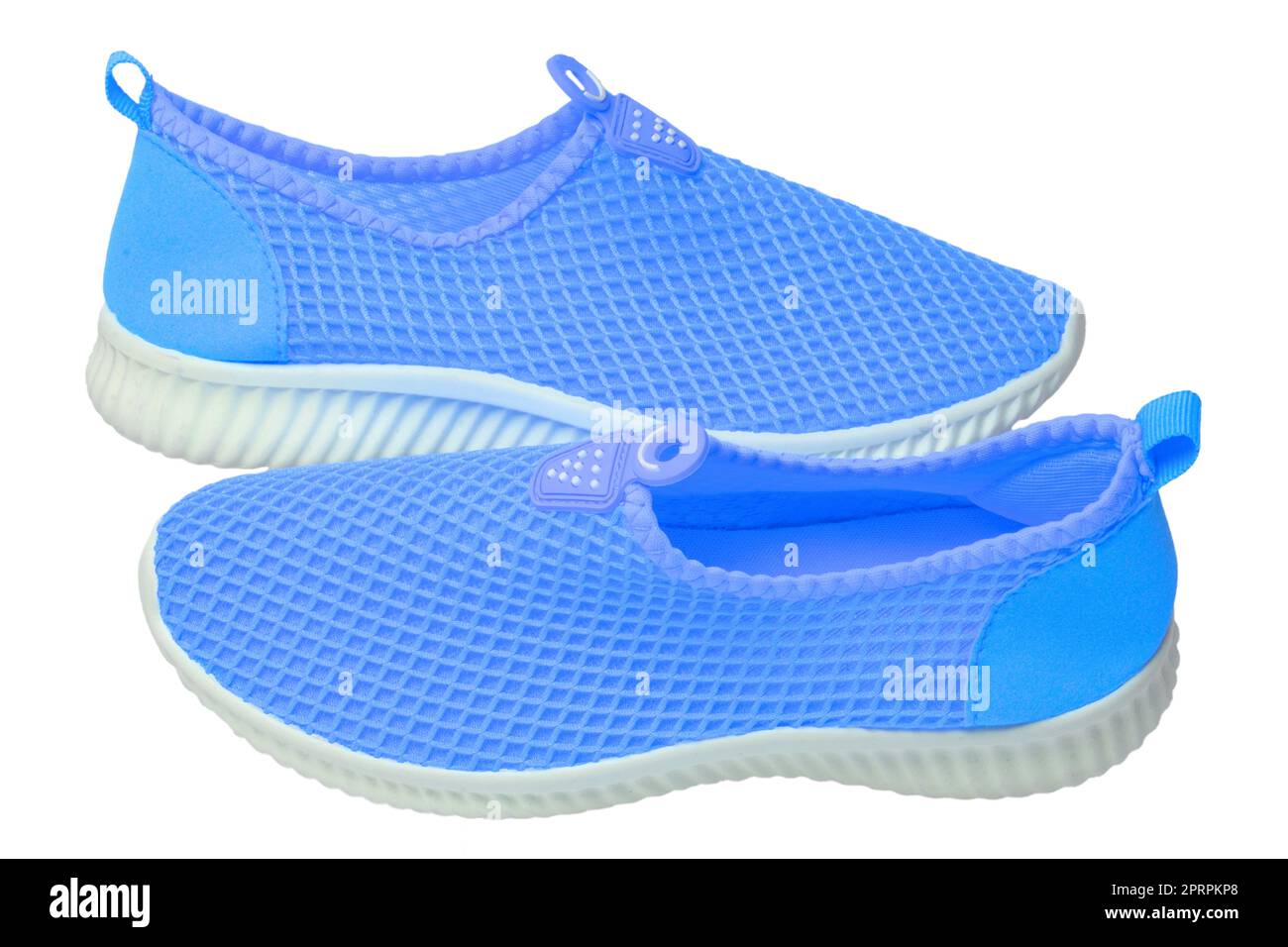 Blue sneaker isolated. Close-up of women's trendy athletic shoes or sport sneakers isolated on a white background. Modern footwear design for workout. Macro. Stock Photo