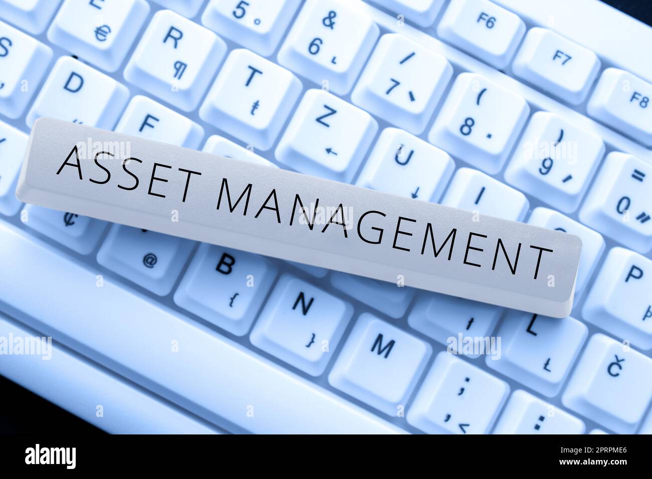 Hand writing sign Asset Managementsystematic process of operating and