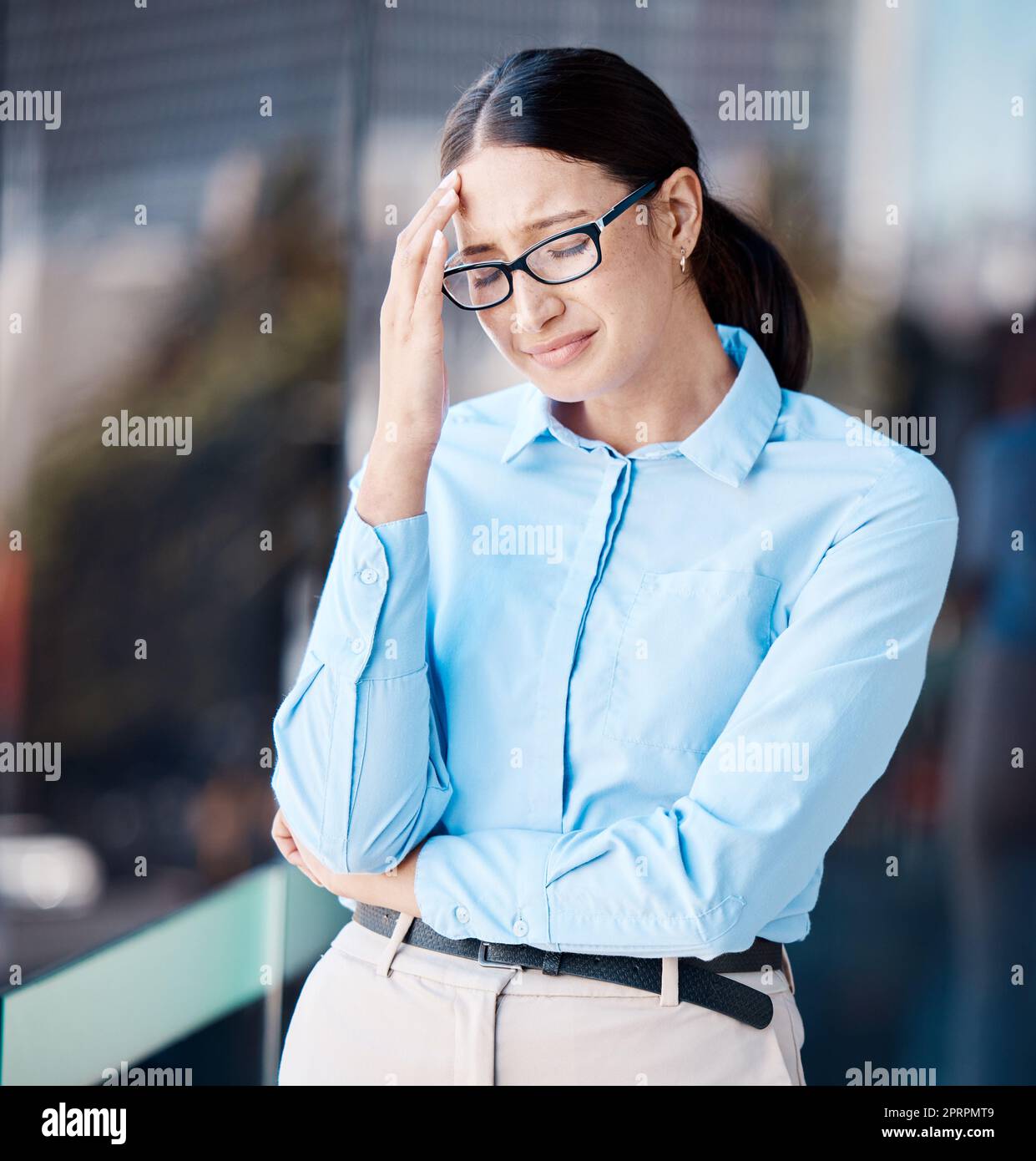 Stress, depression and crying of a business woman feeling overwhelmed, tired and sad while under pressure and struggling with mental health outside. Failure, mistake and anxiety after being fired Stock Photo