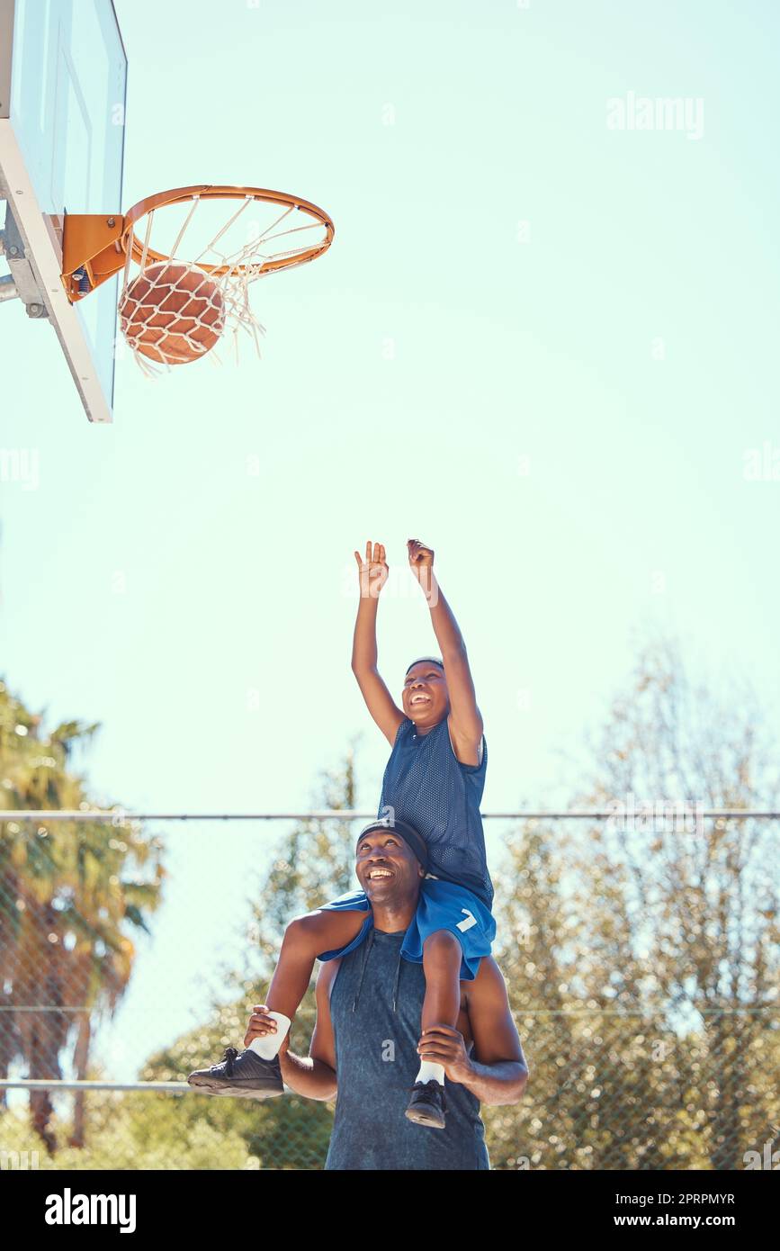 Basketball court, family smile and fun together. Child learning sports
