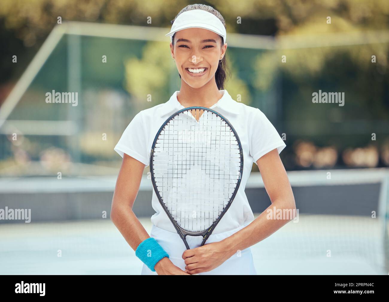 Health, training and tennis player happy and ready for a game outdoors on a tennis court. Professional, athletic and black woman confident while practice skill for competition, sports fun and cardio Stock Photo
