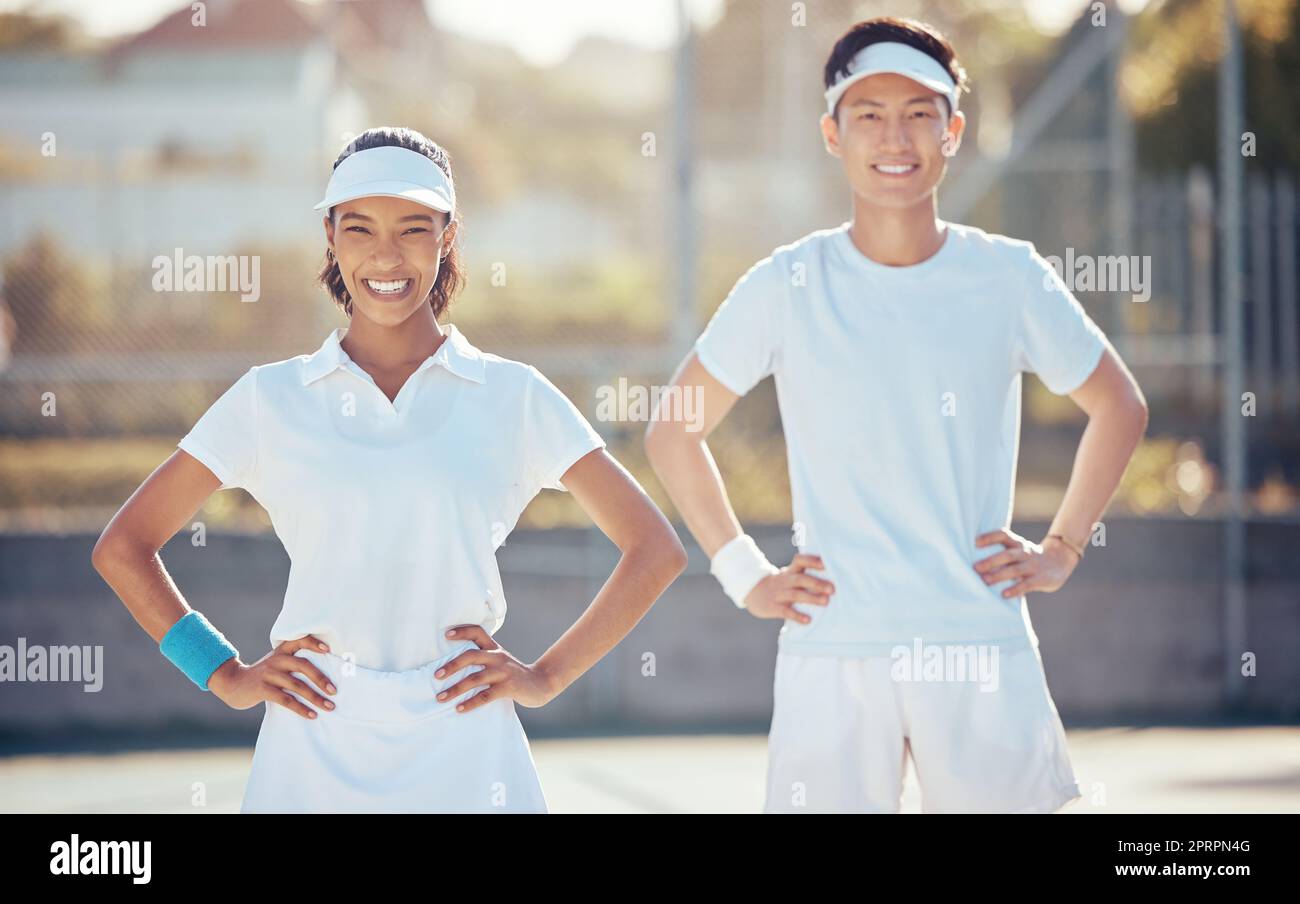 Tennis, teamwork and sports training with athletes on game court together in partnership, competition and unity. Match, fitness and fun with young tennis player and coach in sport exercise Stock Photo