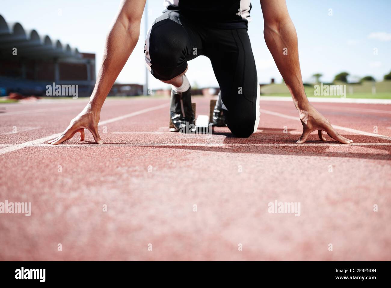 His body is his temple. View of a young runners legs and arms. Stock Photo