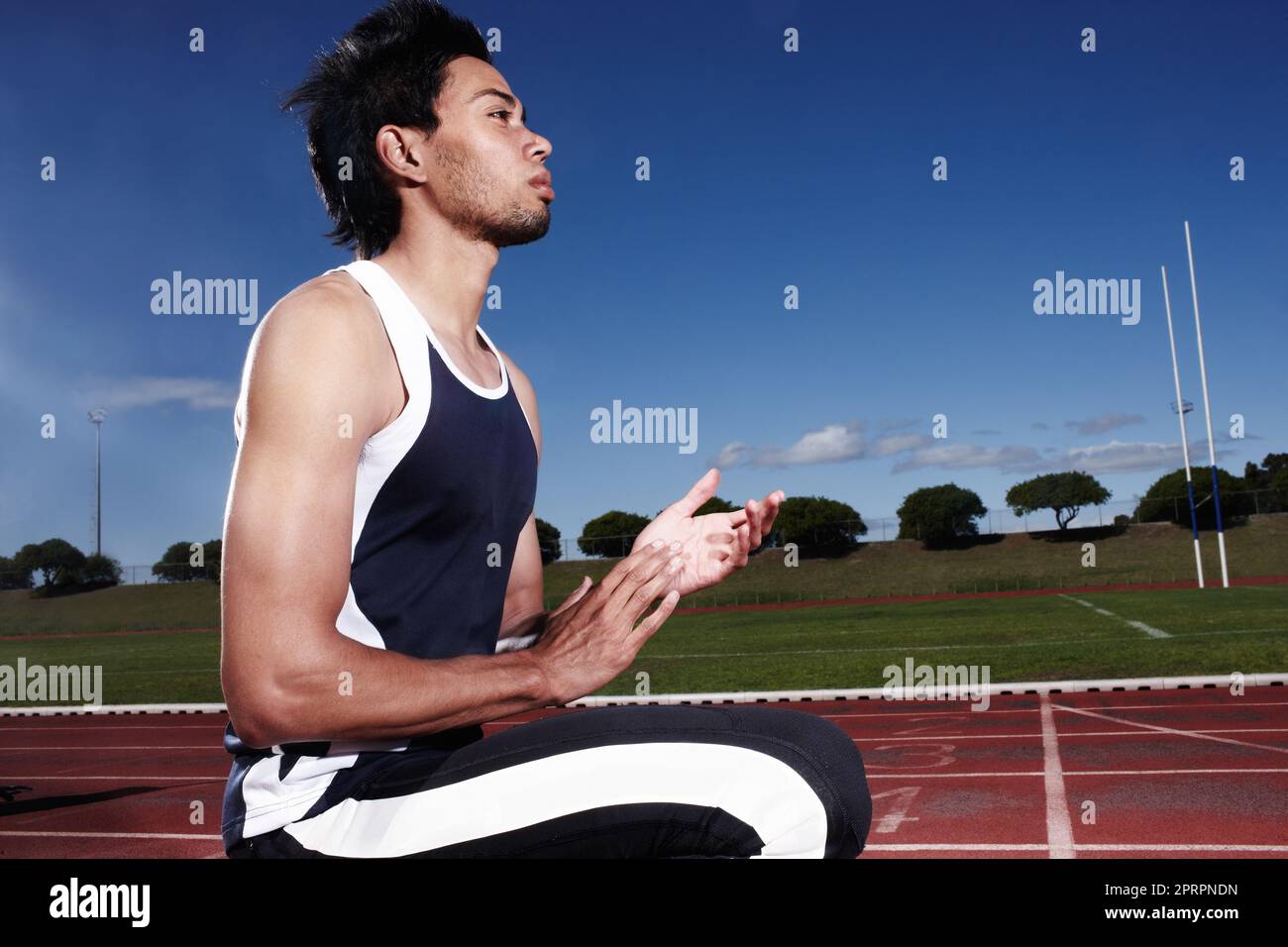 Focussing on my goals. A young athlete introspecting before a race. Stock Photo