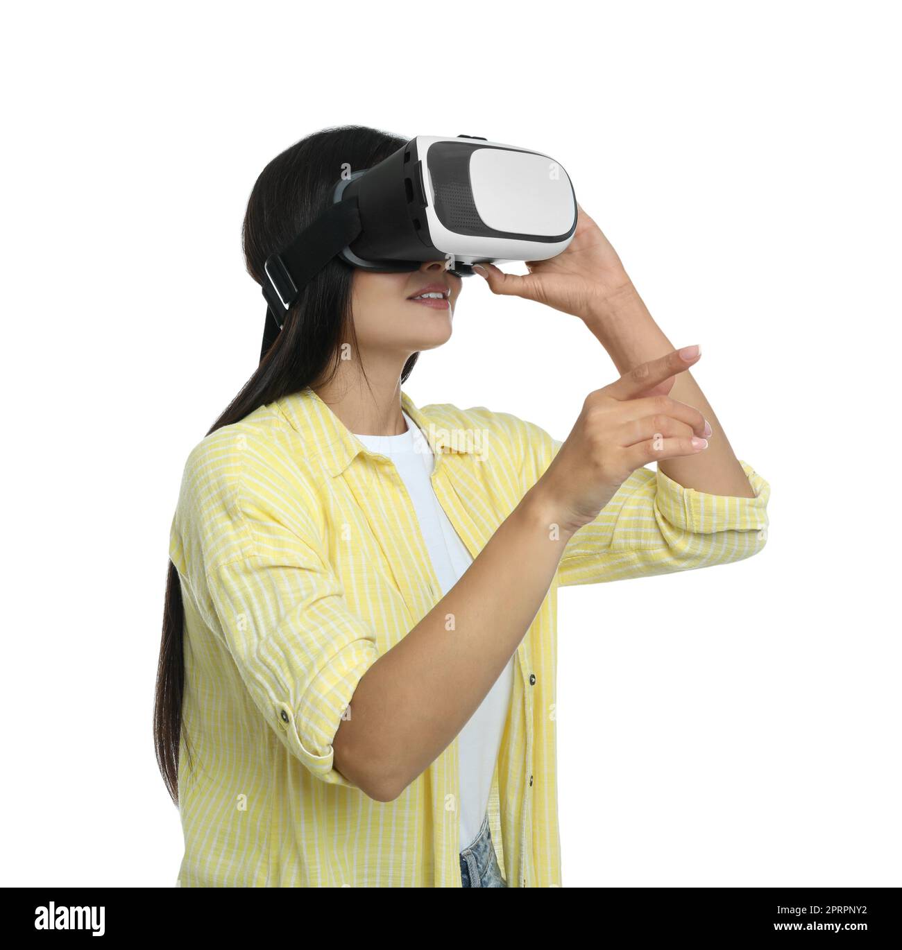 Woman using virtual reality headset on white background Stock Photo - Alamy
