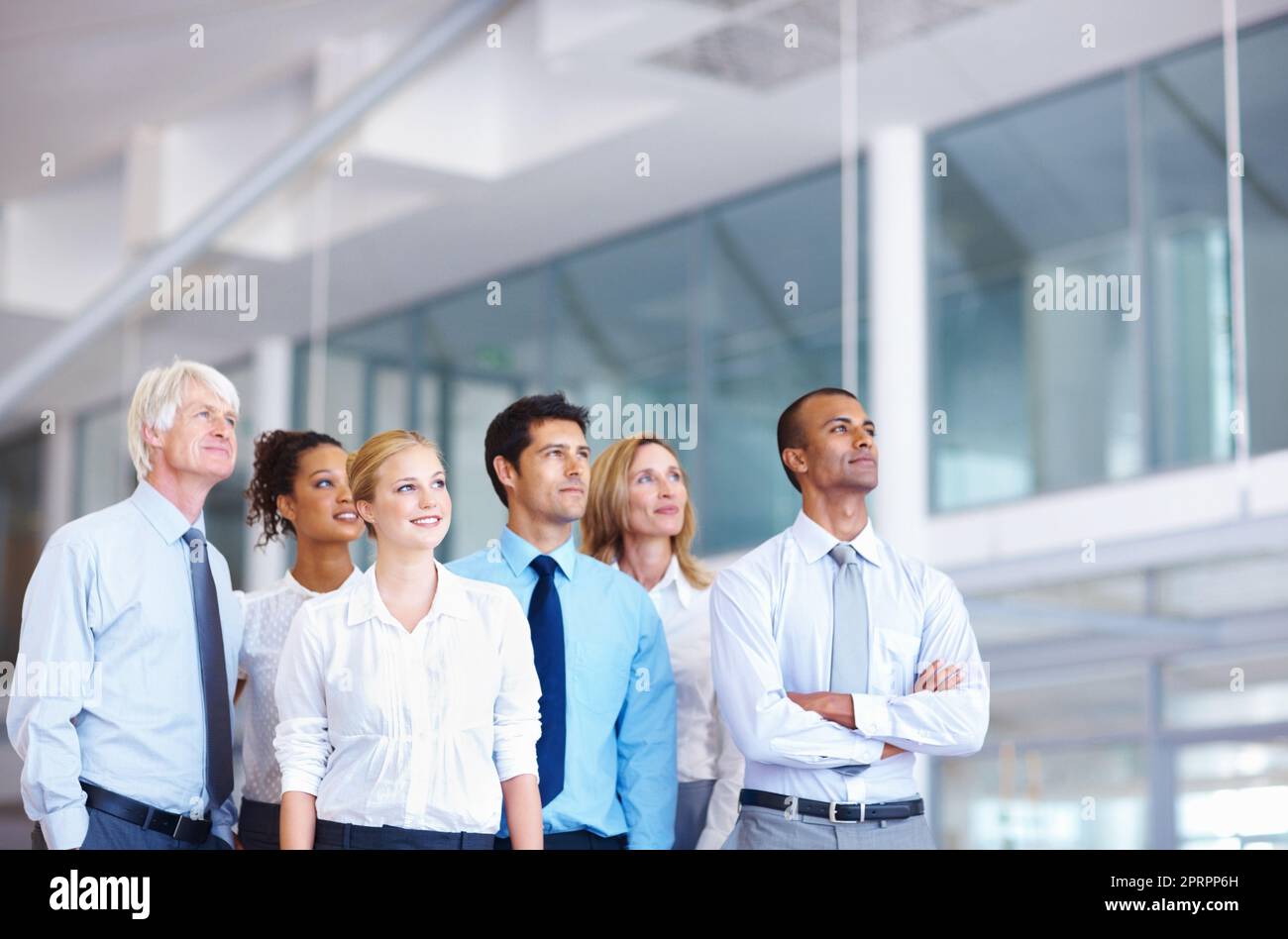 Dream team. Portrait of multi ethnic professionals looking away together at office. Stock Photo
