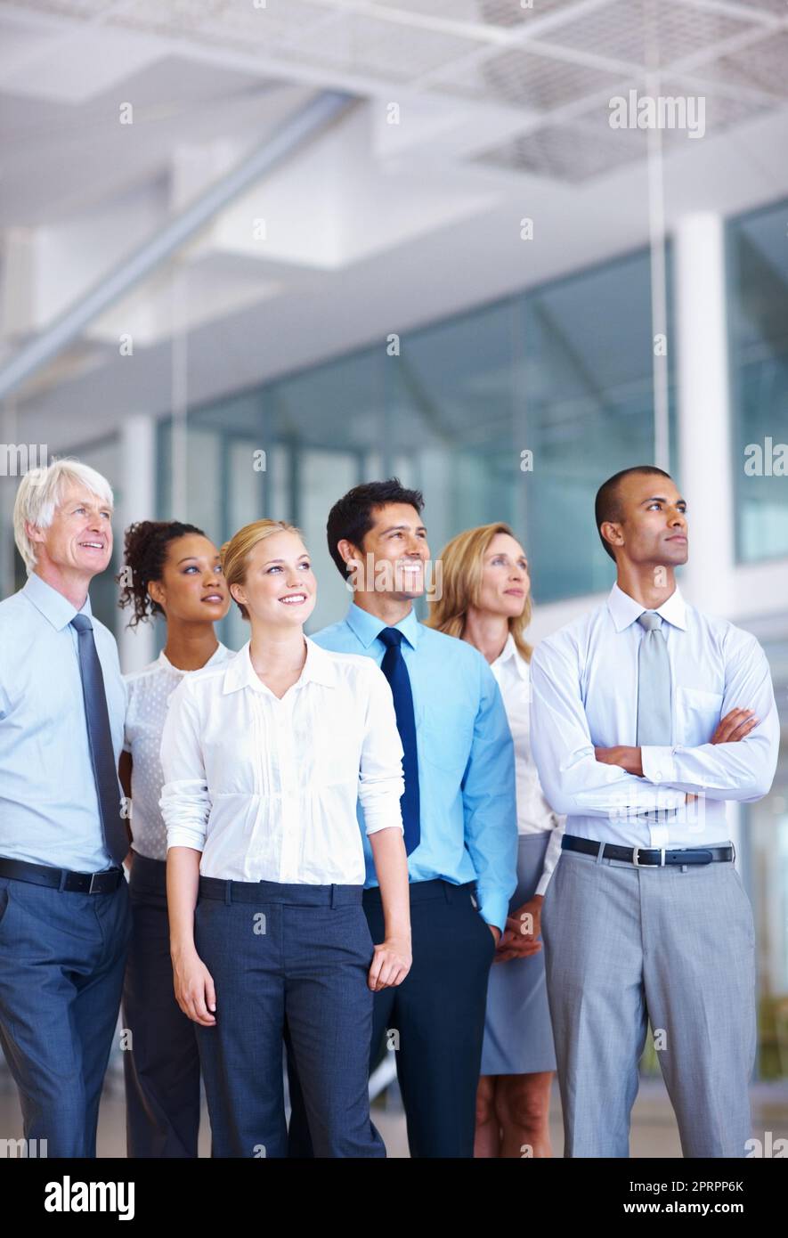 Partners. Portrait of multi racial business partners looking away together at office. Stock Photo
