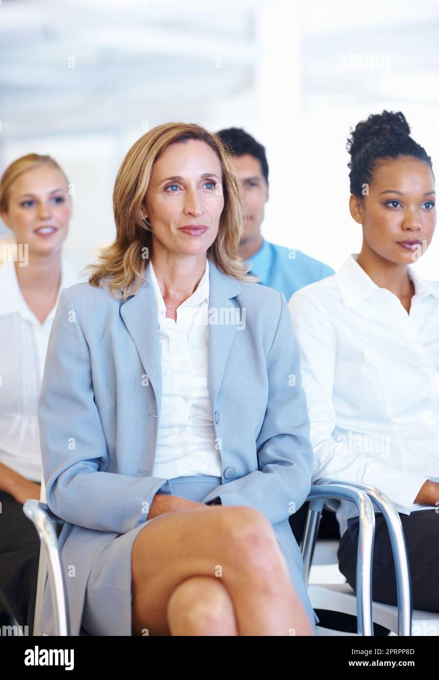 Dedicated business group during meeting. Portrait of dedicated multi racial business group during meeting. Stock Photo