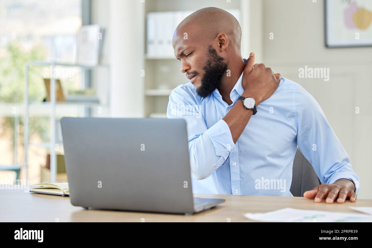 Black man, shoulder pain on laptop in stress and injury suffering from
