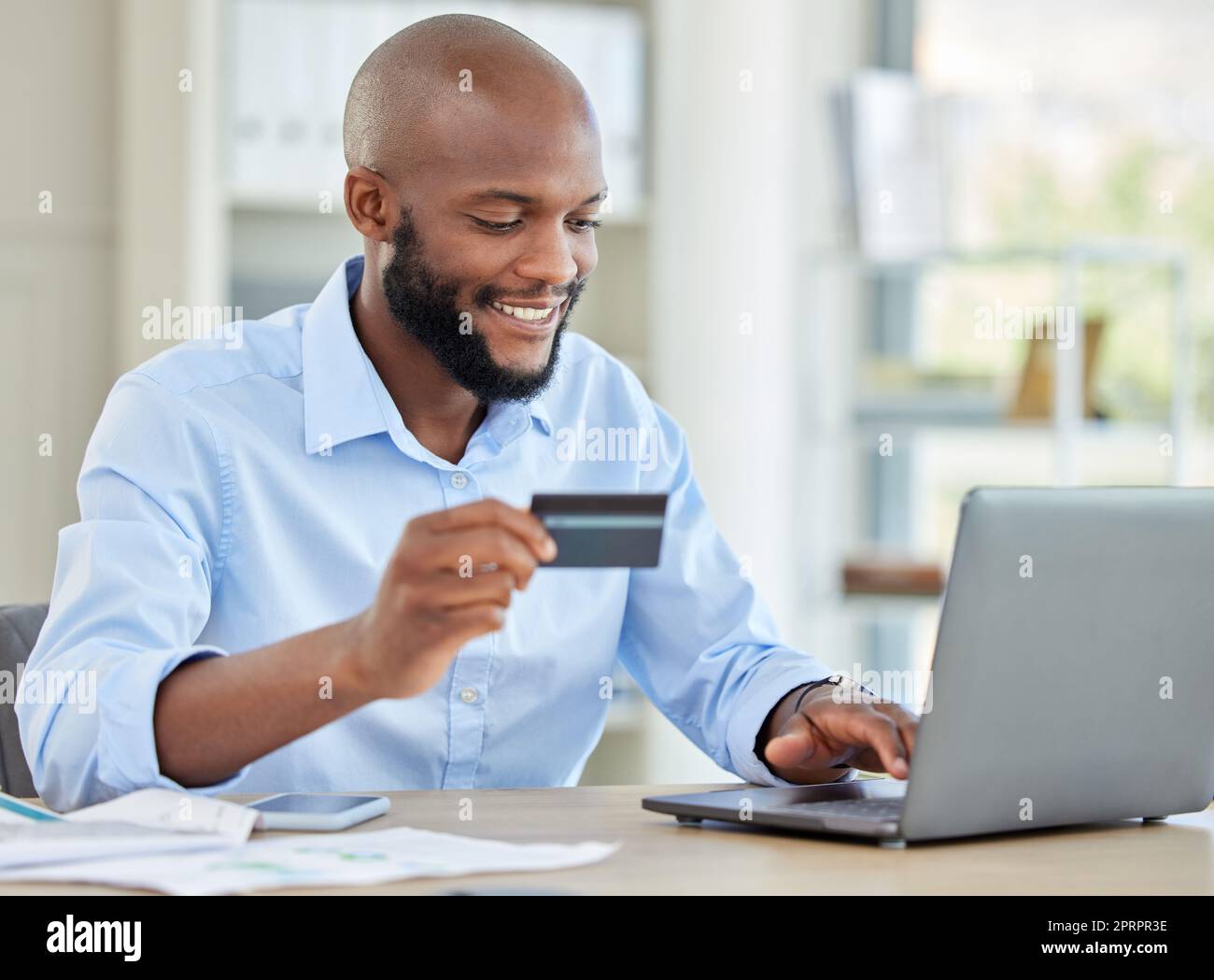 Internet bank, black man online shopping and laptop budget payment for bills, money and credit card cash with ecommerce on web. Finance accounting, business person and trading economy with fintech Stock Photo