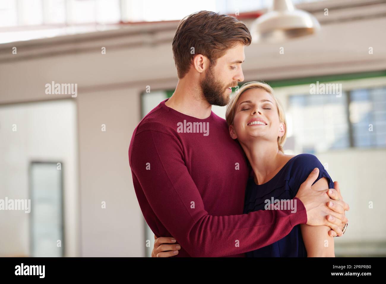 Together in love...and in business. a couple working together in an open office. Stock Photo