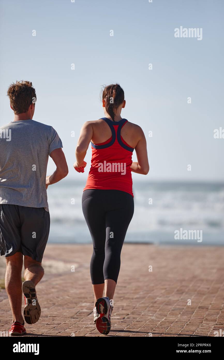 On their way to a healthier life. a young couple exercising outdoors. Stock Photo