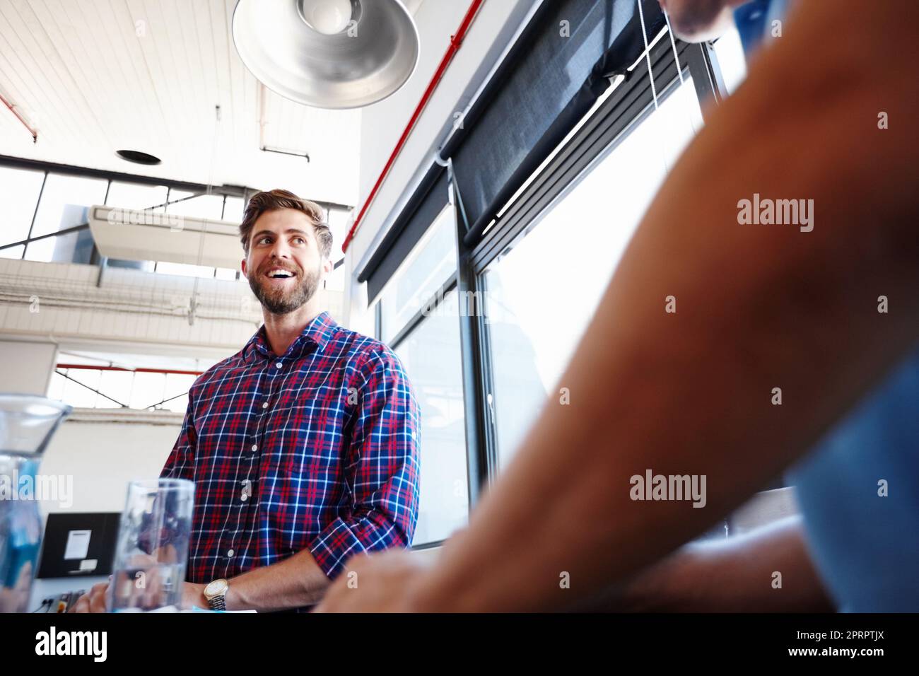 He has it all planned out. Low angle shot of a handsome young man at the office. Stock Photo