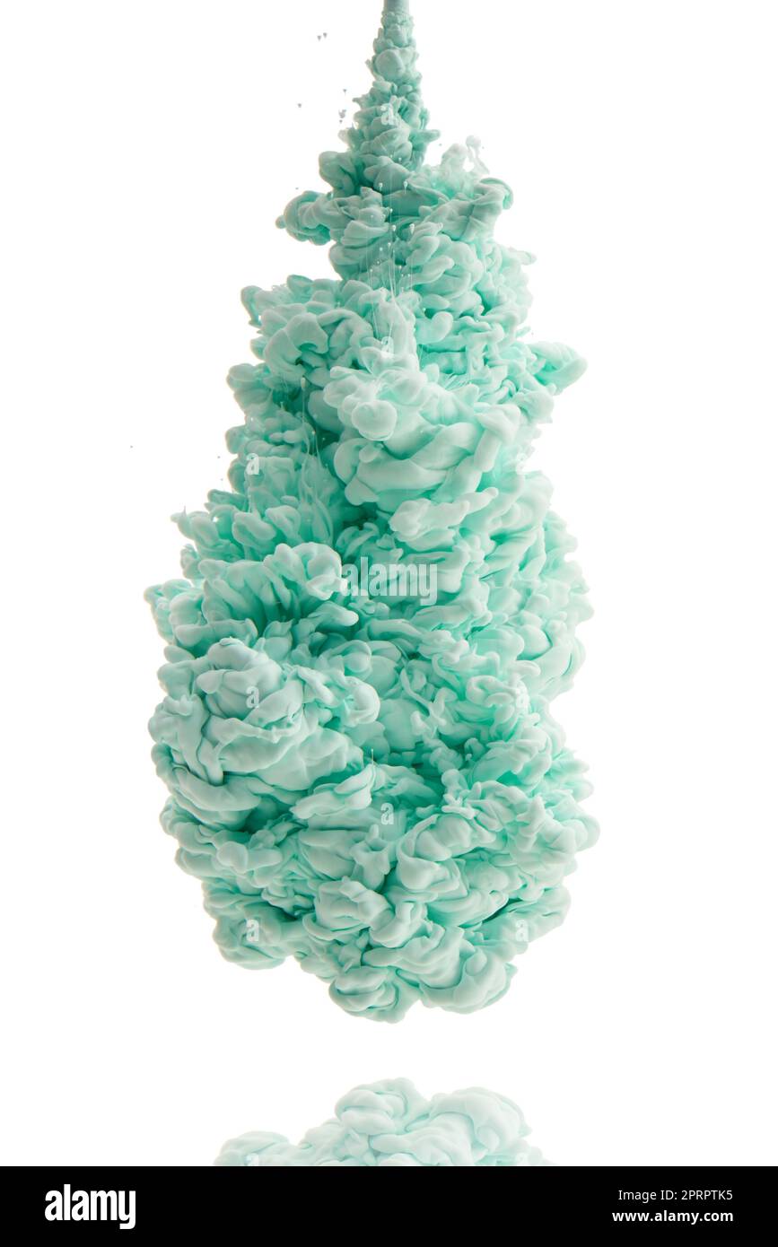 Its a color explosion. Studio shot of green ink in water against a white background. Stock Photo