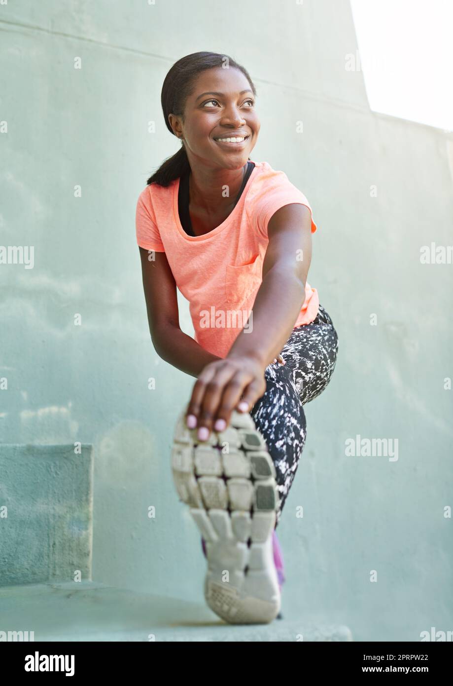 Woman stretching hamstrings hi-res stock photography and images - Alamy