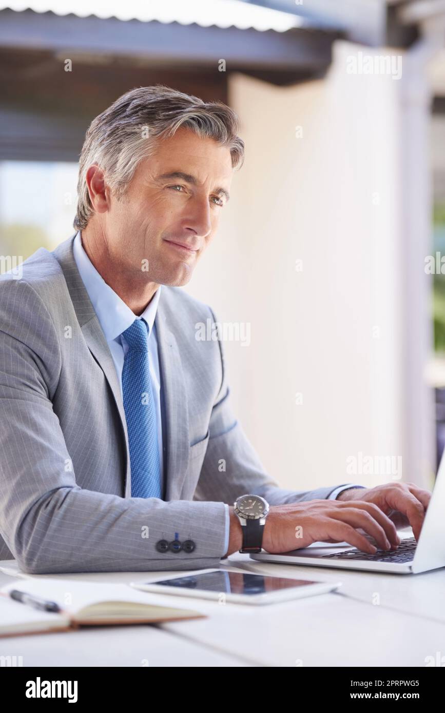 Working with professionalism. a handsome businessman in the office. Stock Photo