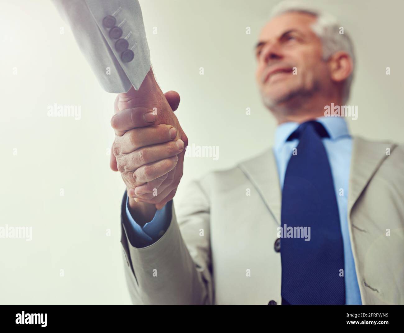 Another deal done. two businessmen shaking hands. Stock Photo