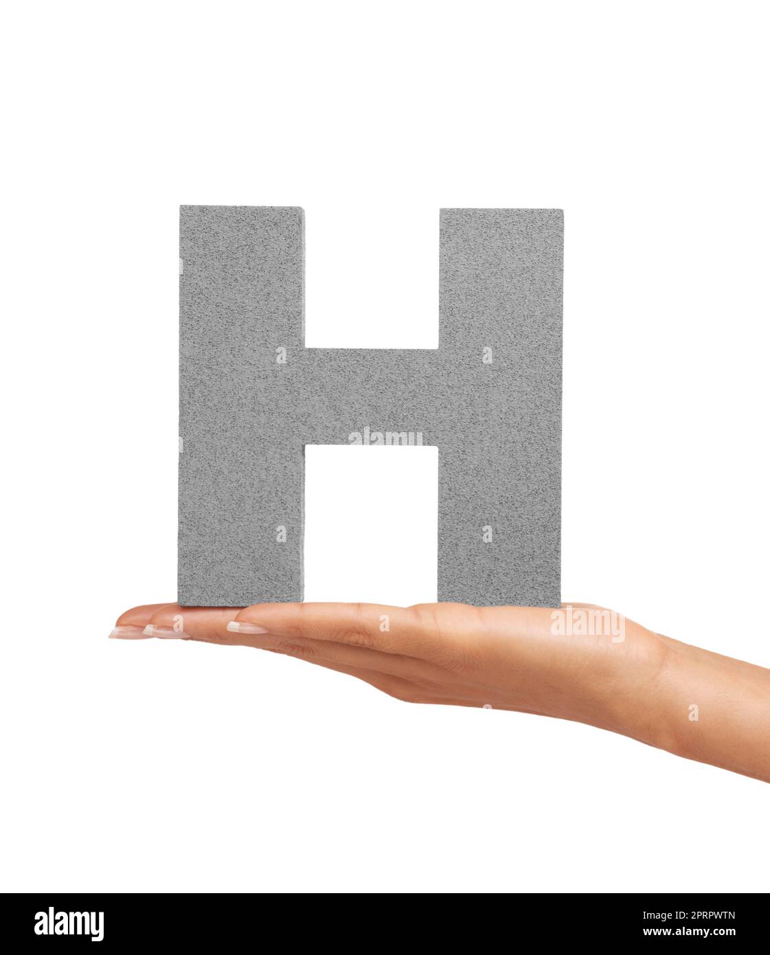 How do you do. A young woman holding a capital letter H isolated on a white background. Stock Photo