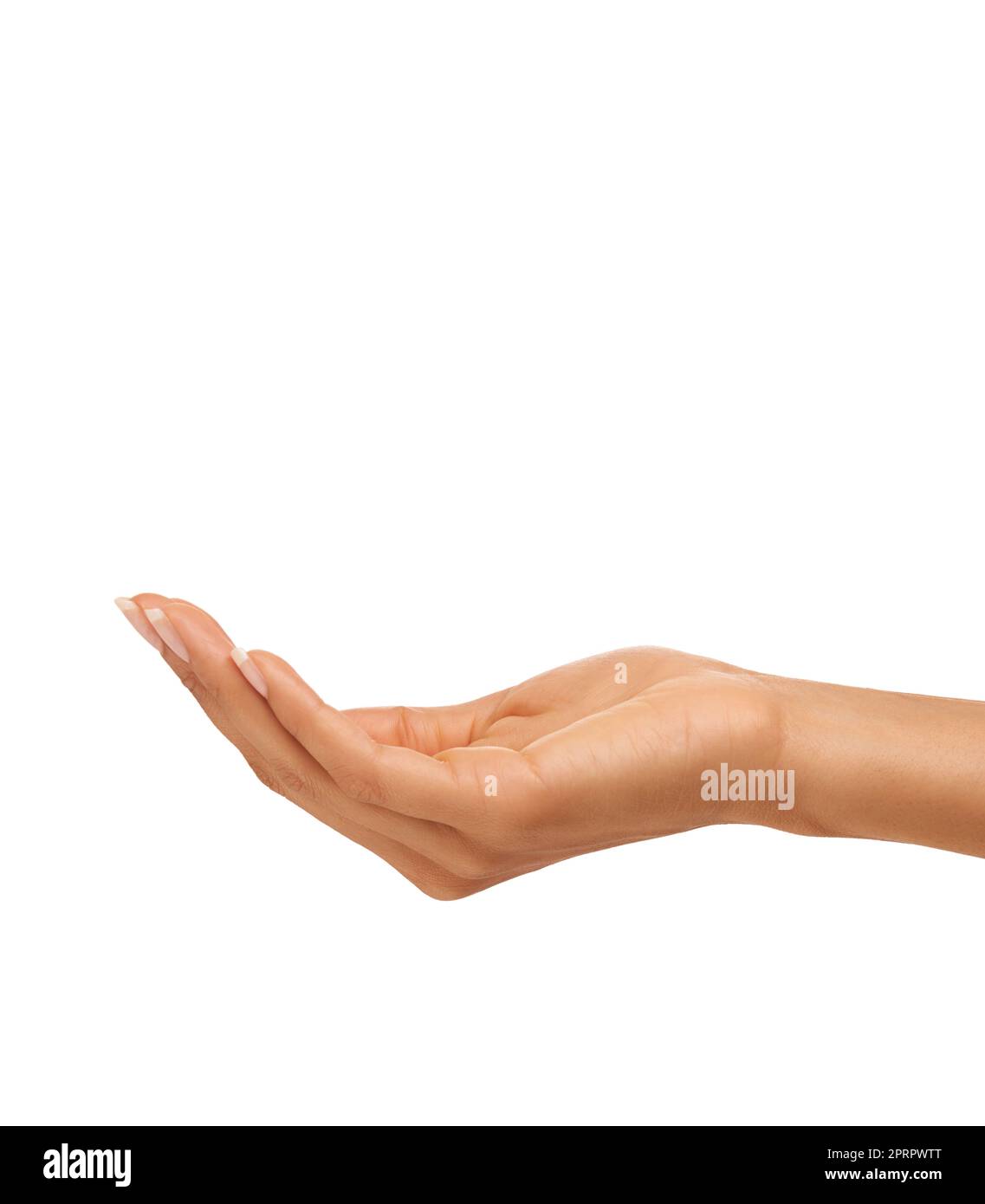 Holding your skincare product. A young womans hand isolated on a white background. Stock Photo