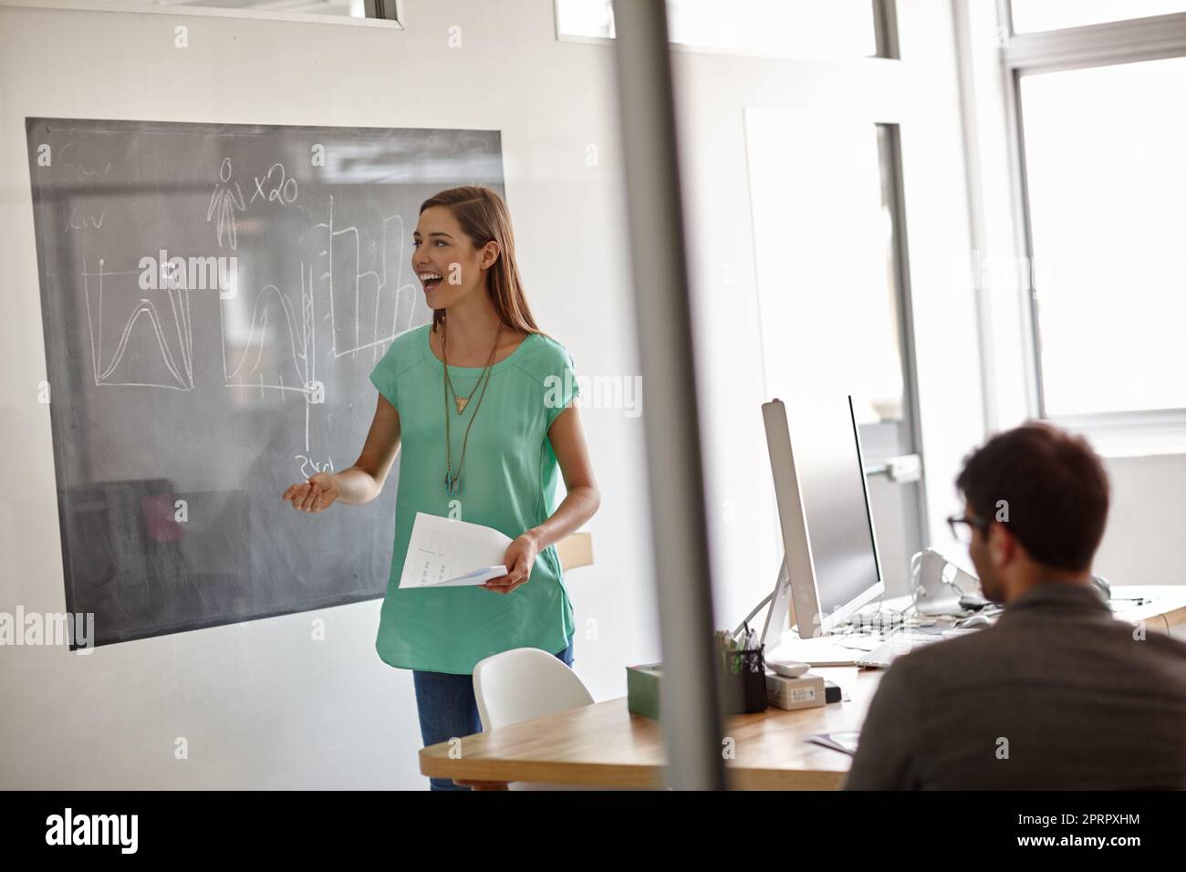 Positive about her performance. a young designer smiling positively