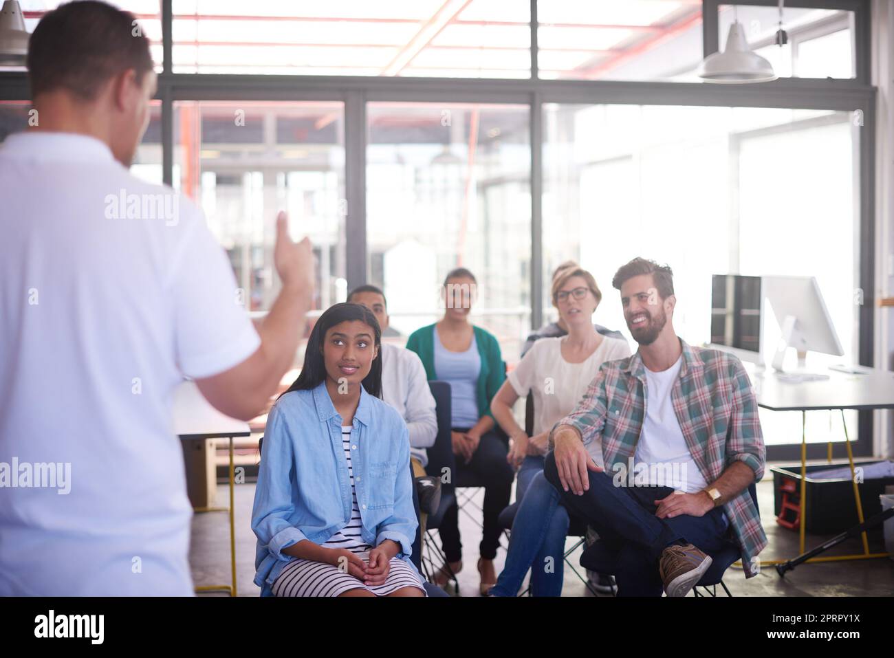 They each have their own ideas. young designers working together in their office. Stock Photo