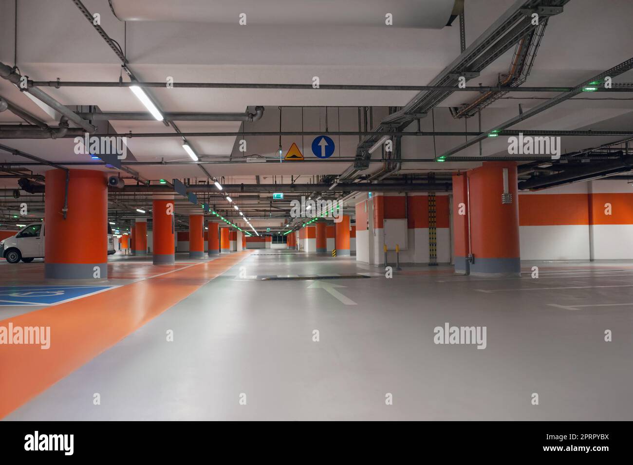 Empty car parking garage with lighting and columns Stock Photo Alamy