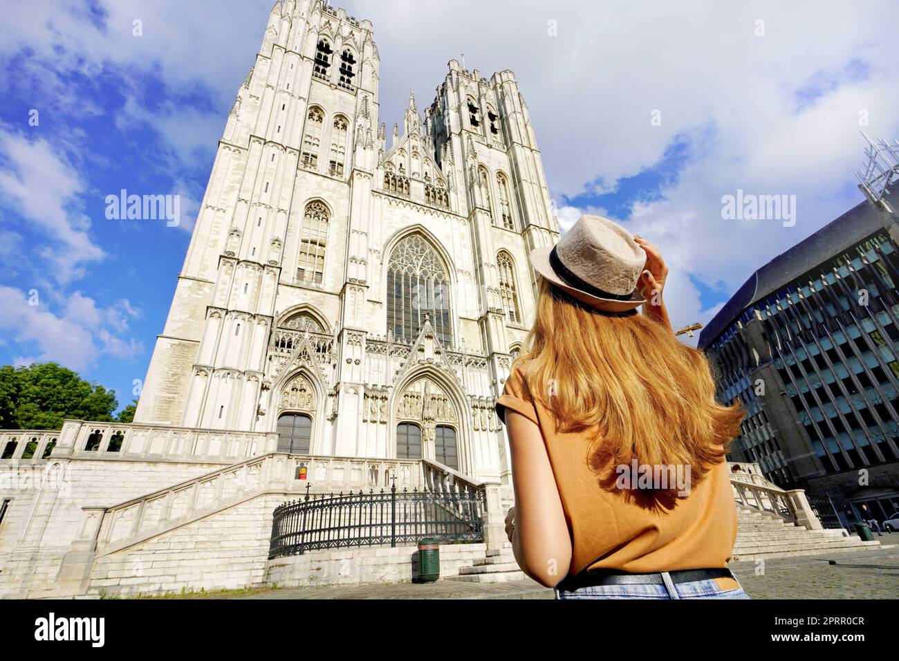 Tourism in Brussels. Back view of tourist girl visiting Brussels Cathedral, Belgium, Europe. Stock Photo