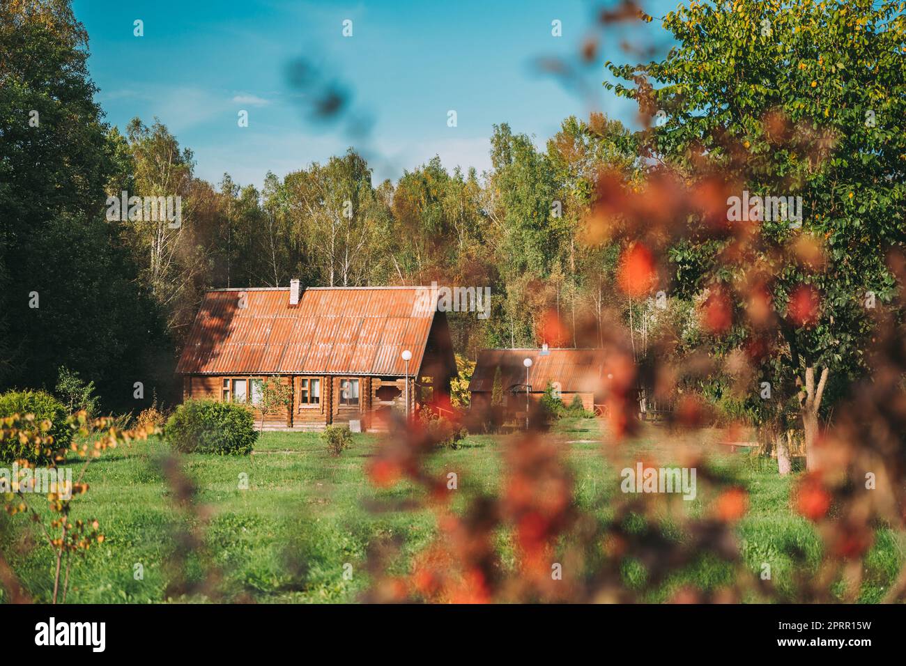 Berezinsky, Biosphere Reserve, Belarus. Traditional Belarusian Tourist Guest Houses In Early Autumn Landscape. Popular Place For Rest And Active Eco-tourism In Belarus Stock Photo