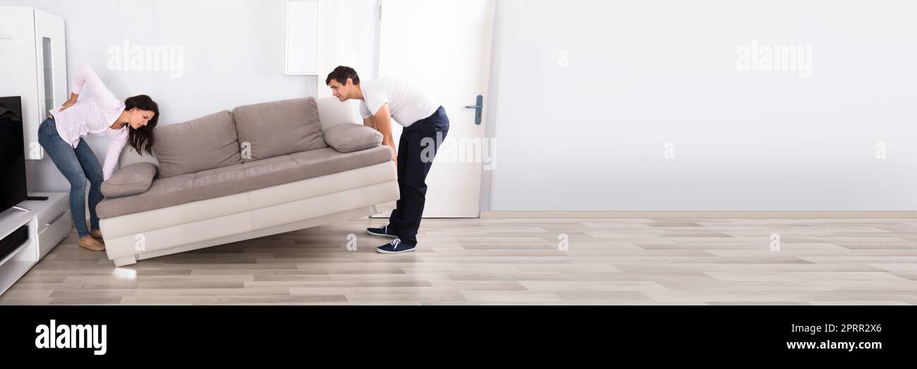 Sofa Lifting Pain. Young Couple Move Furniture Stock Photo Alamy