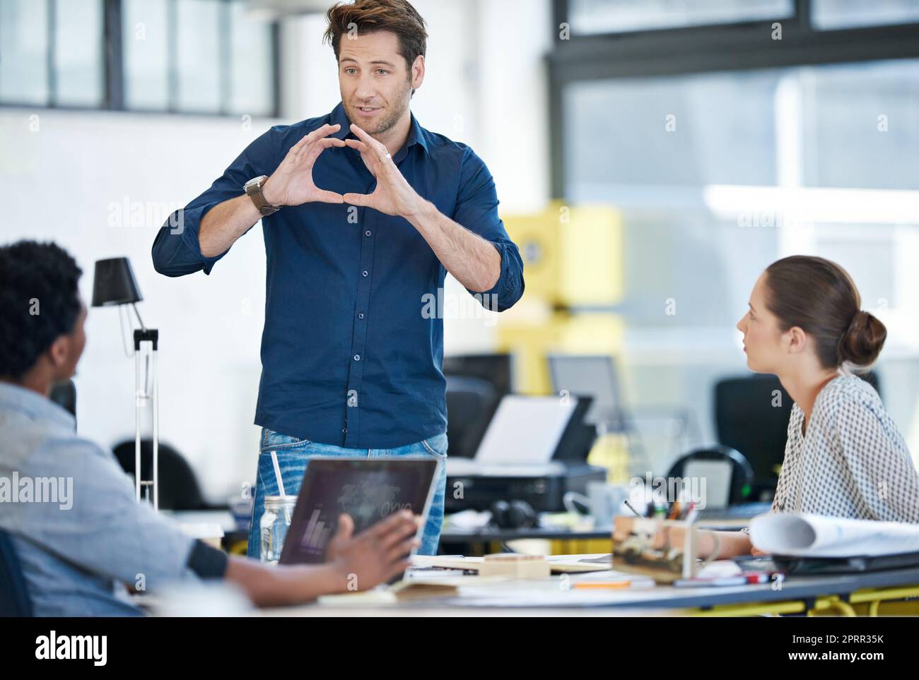 Creating workplace synergy. a group of young designers working together in an office. Stock Photo