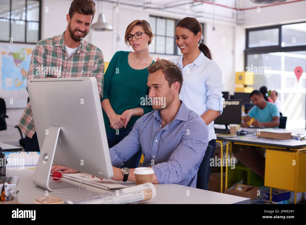 They each have their own ideas. young designers working together in their office. Stock Photo