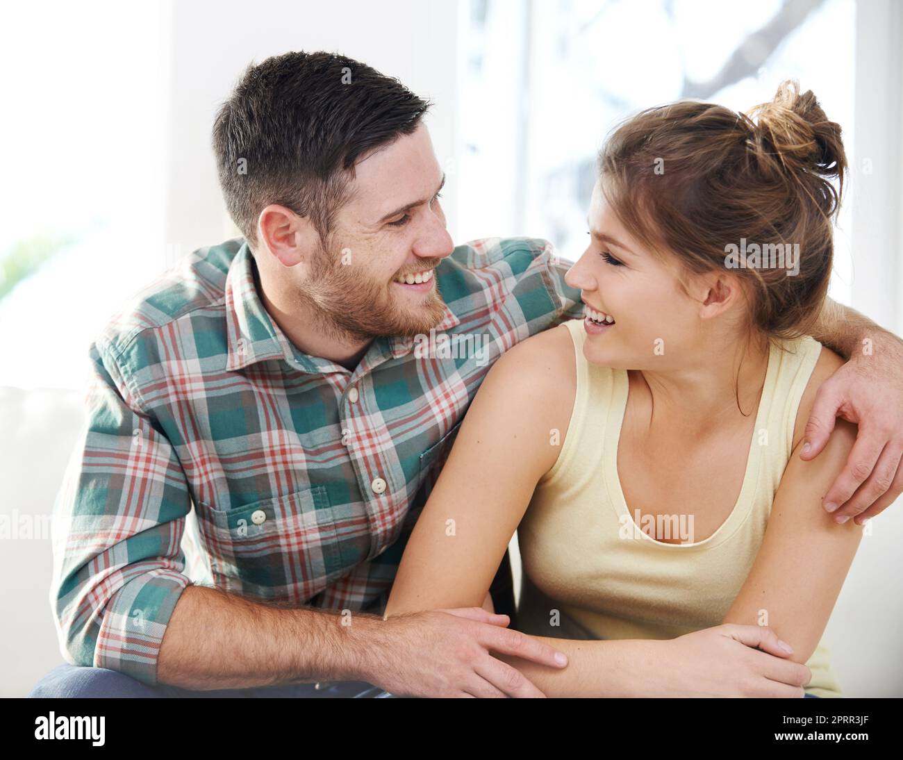 My favorite place in the world... next to you. a loving young couple sharing  a romantic moment at home Stock Photo - Alamy