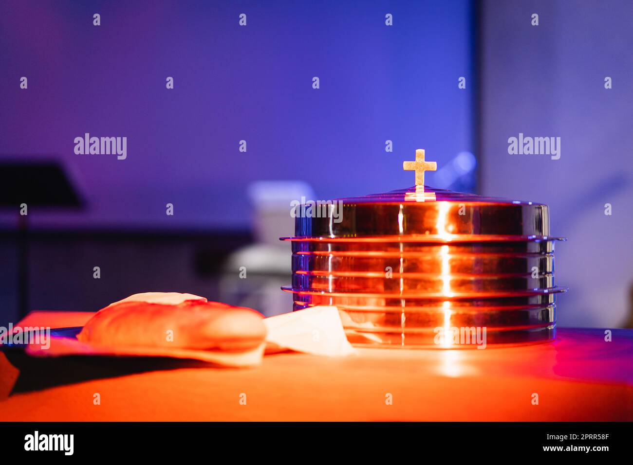The process of breaking bread in the modern church Stock Photo Alamy