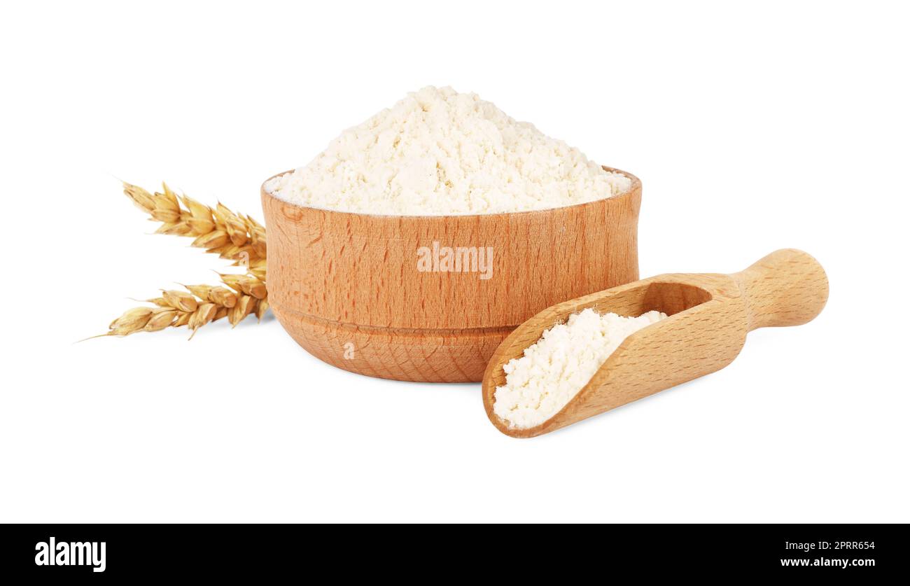 Wooden bowl and scoop with wheat flour isolated on white Stock Photo