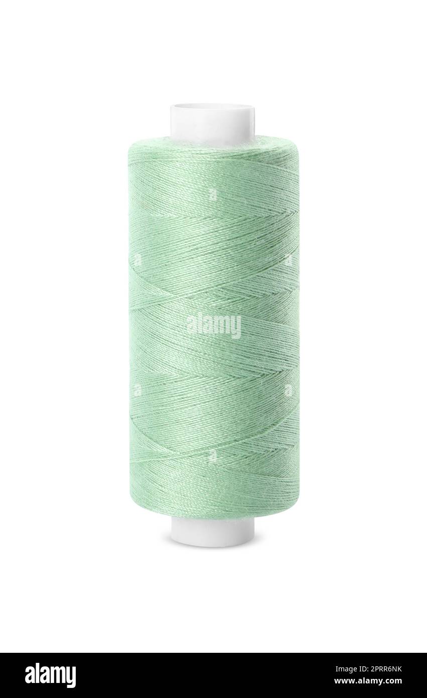 Spool of light green sewing thread isolated on white Stock Photo Alamy