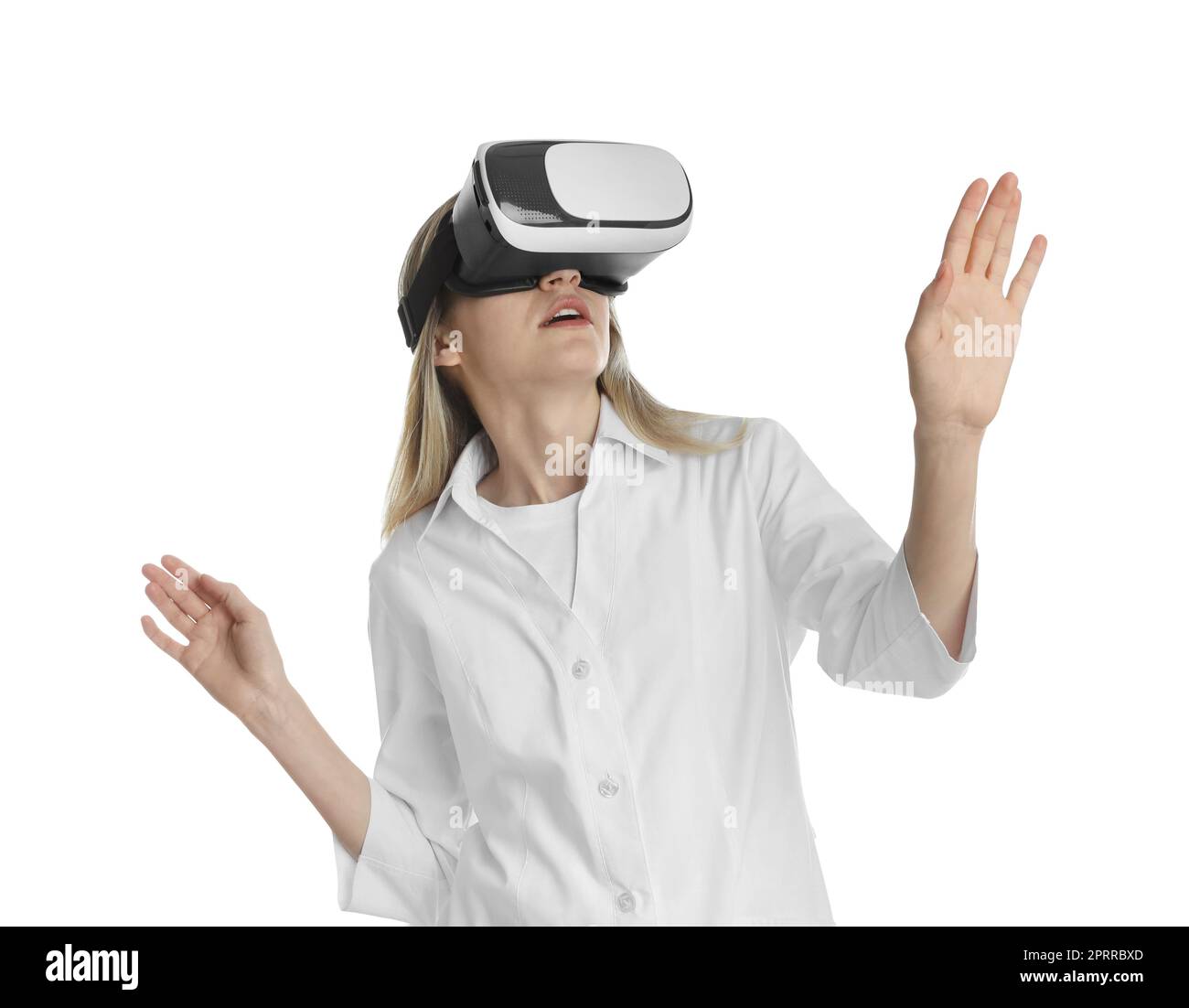 Young woman using virtual reality headset on white background Stock ...